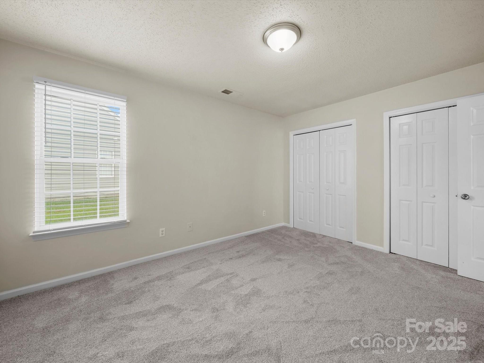 6420 Sunman Road Charlotte, NC 28216 - Photo 19 of 43 an empty room with a window