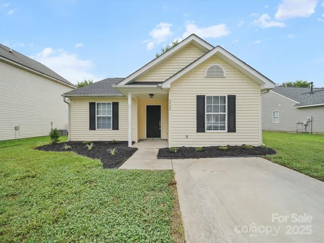 a front view of a house with yard