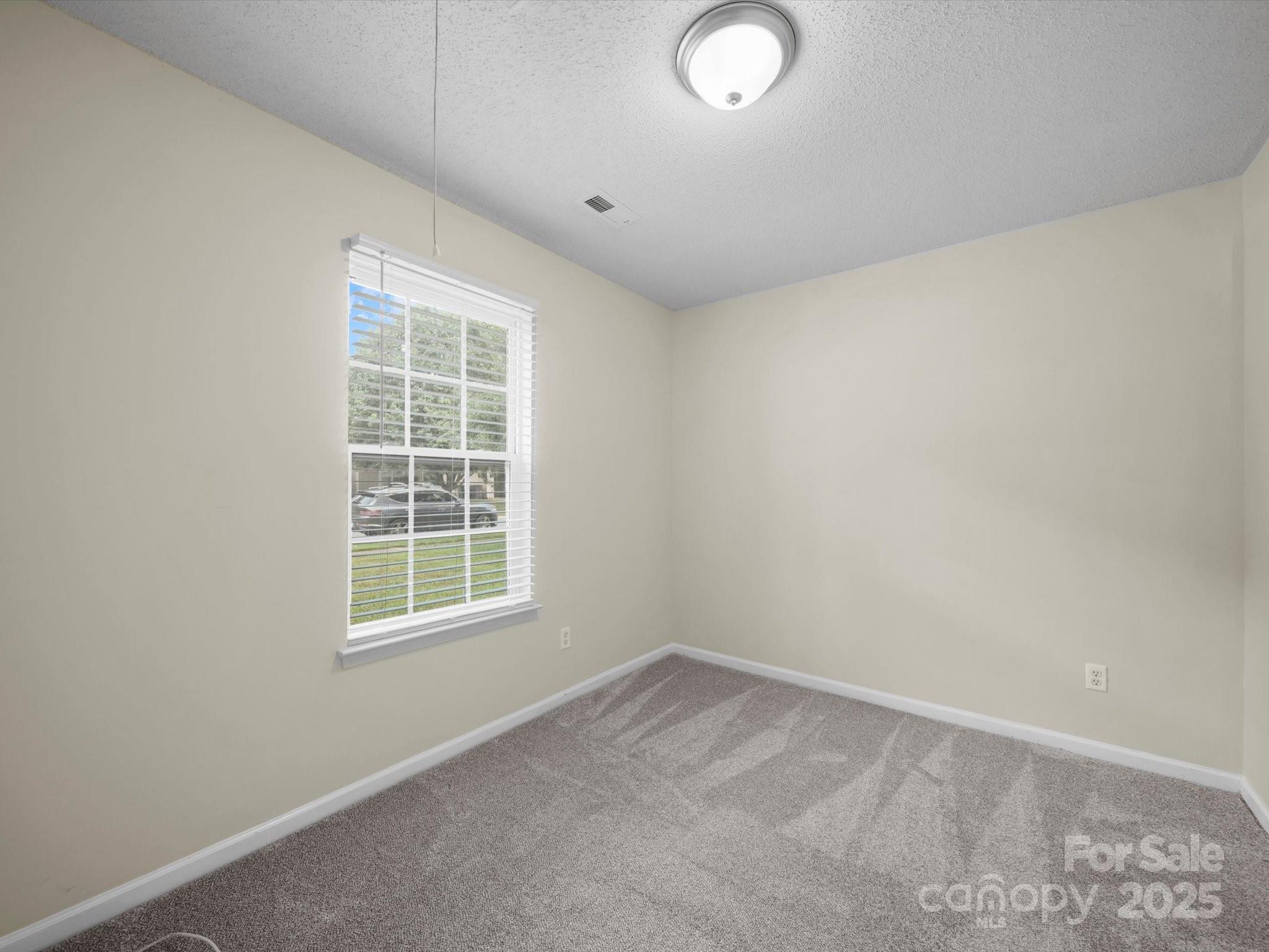 6420 Sunman Road Charlotte, NC 28216 - Photo 26 of 43 an empty room with a window