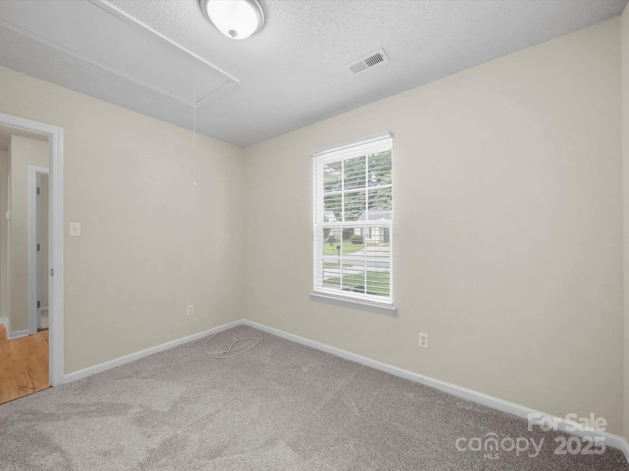 6420 Sunman Road Charlotte, NC 28216 - Photo 28 of 43 an empty room with windows and closet