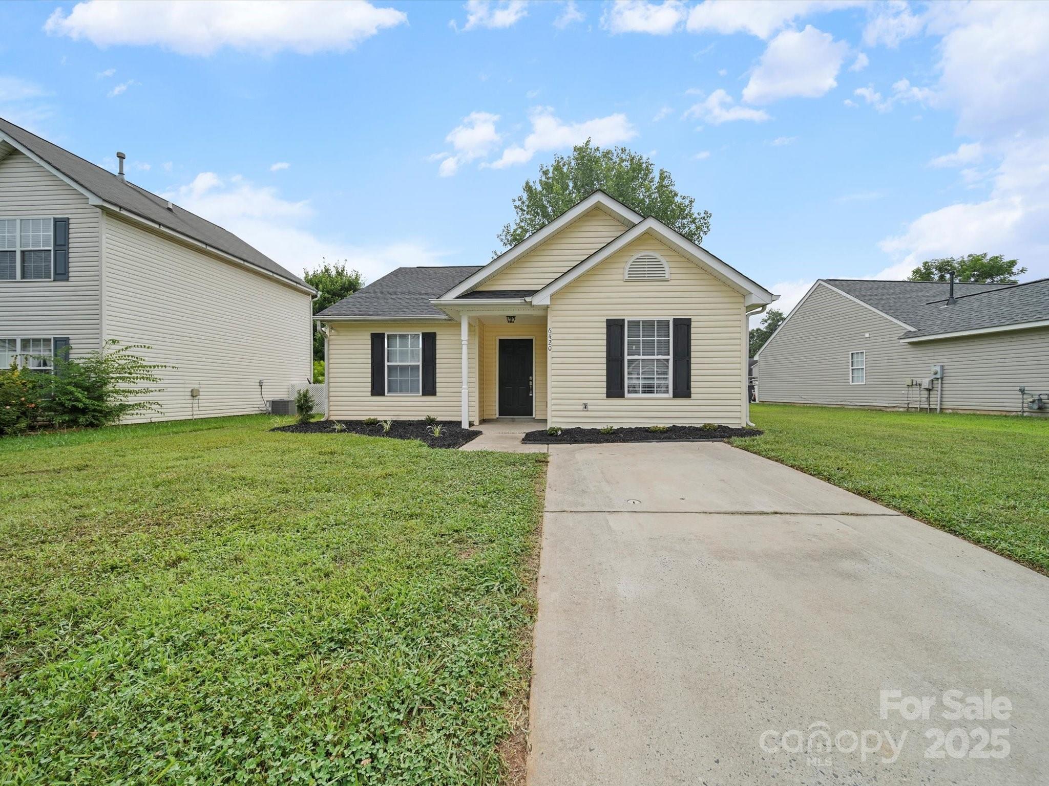 6420 Sunman Road Charlotte, NC 28216 - Photo 34 of 43 a front view of house with yard and green space