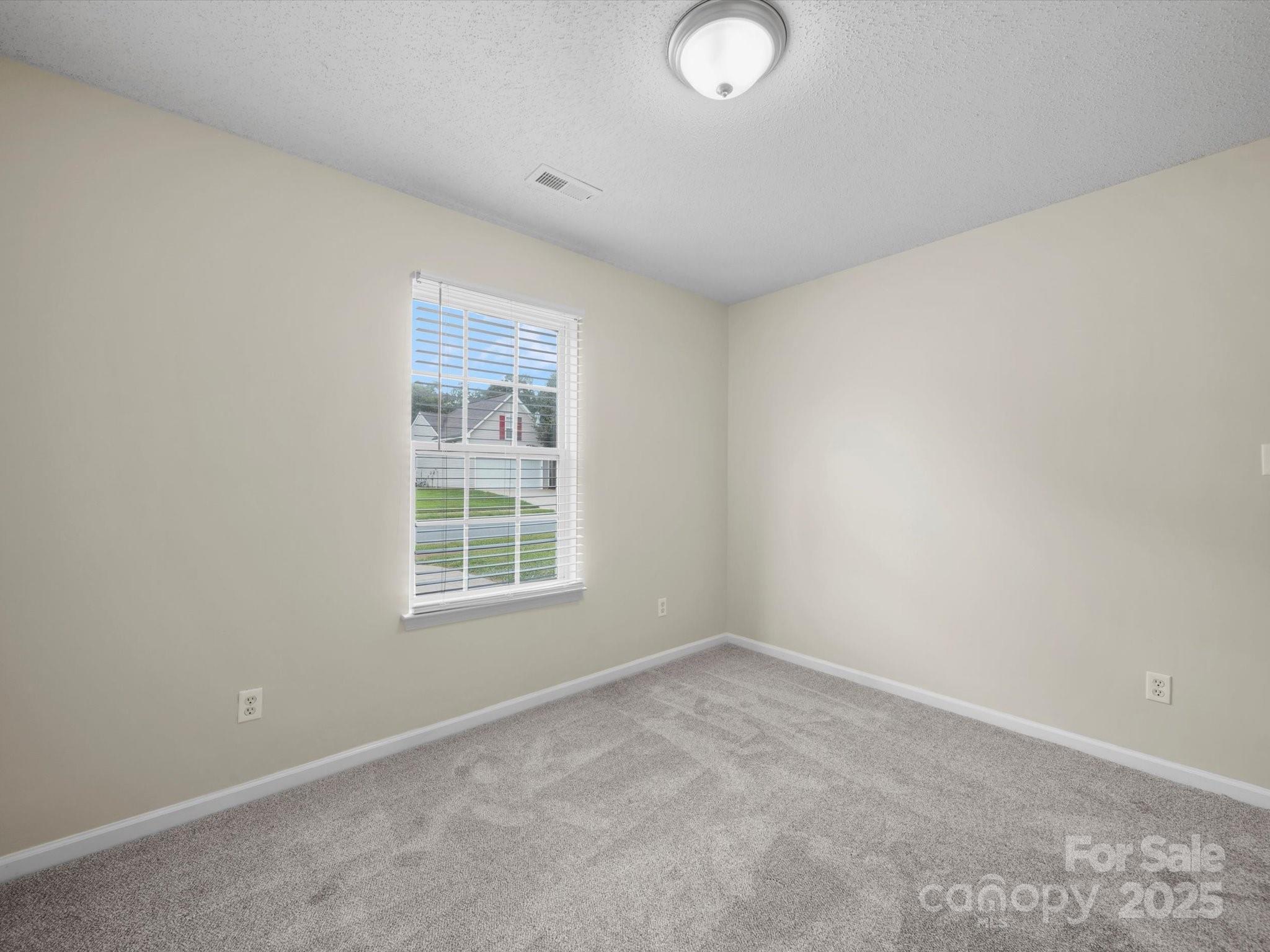 6420 Sunman Road Charlotte, NC 28216 - Photo 36 of 43 an empty room with a window