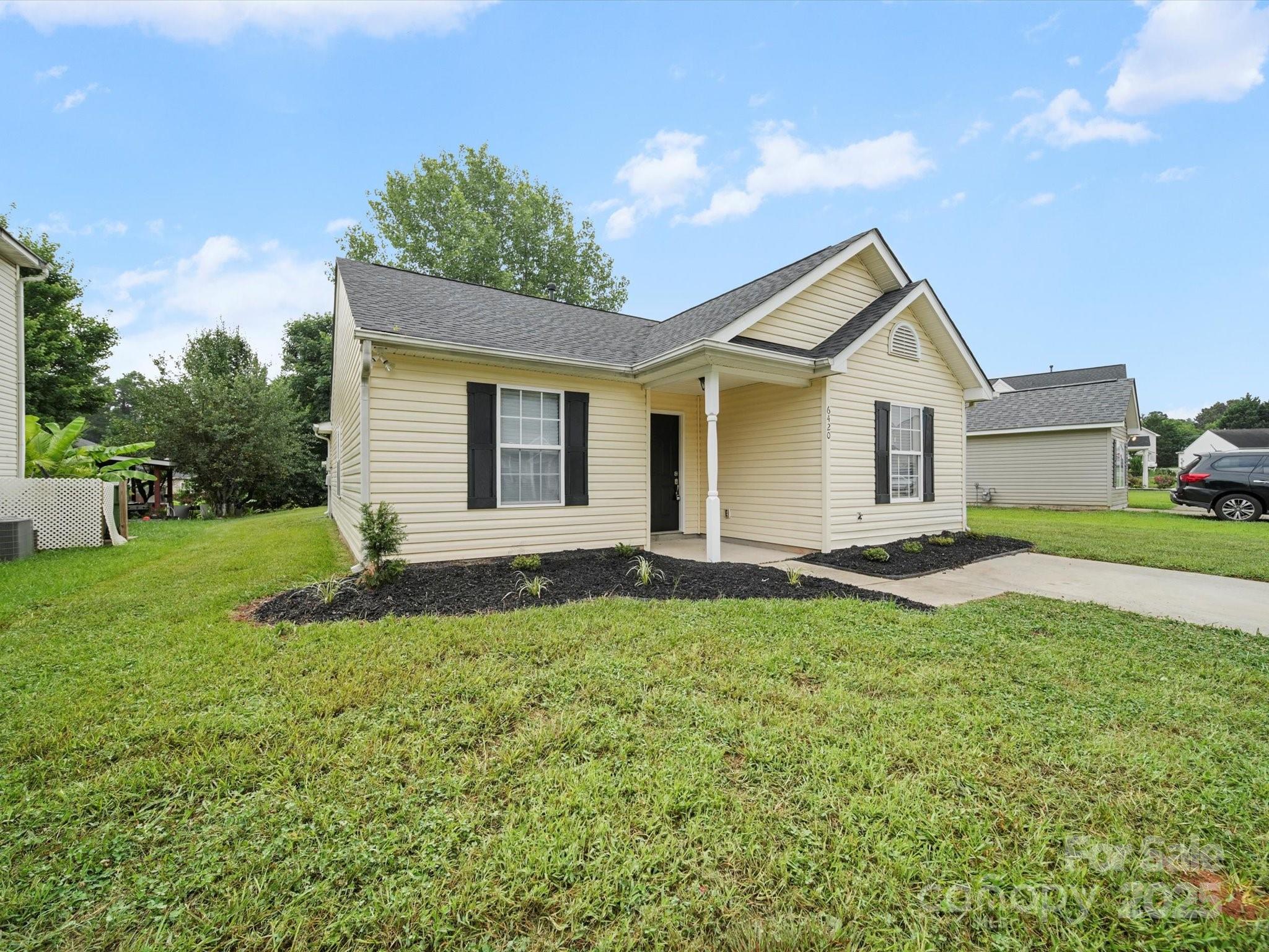6420 Sunman Road Charlotte, NC 28216 - Photo 40 of 43 a view of a house with backyard and garden