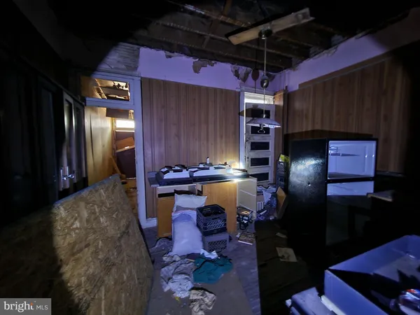 a room with lots of furniture and clutter