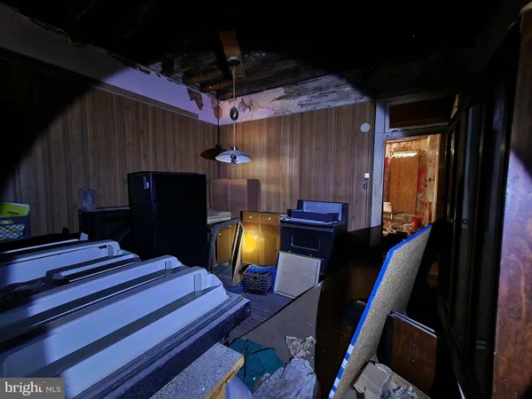 a room with wooden furniture and musical instruments