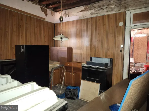 a kitchen with a stove and a refrigerator