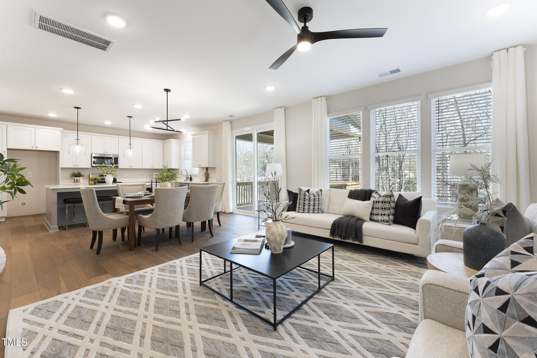 604 Whistable Avenue Wake Forest, NC 27587 - Photo 16 of 44 a living room with furniture and a large window