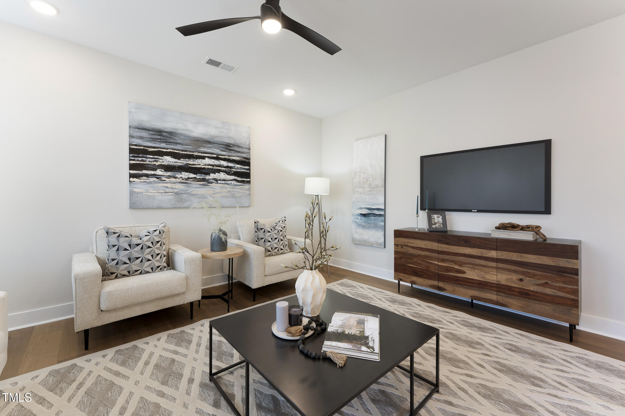 604 Whistable Avenue Wake Forest, NC 27587 - Photo 18 of 44 a living room with furniture and a flat screen tv