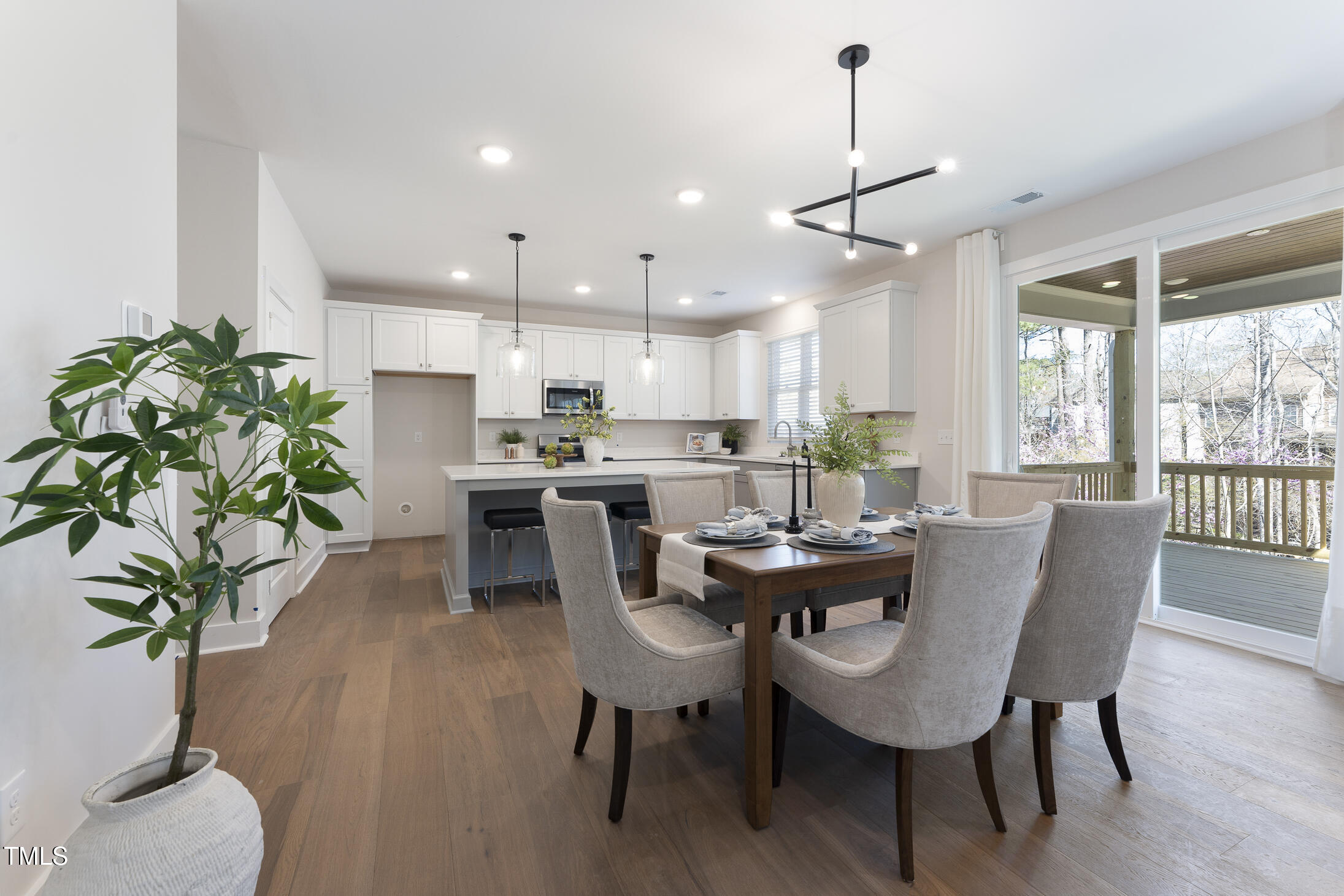 604 Whistable Avenue Wake Forest, NC 27587 - Photo 19 of 44 a view of a dining room with furniture window and wooden floor