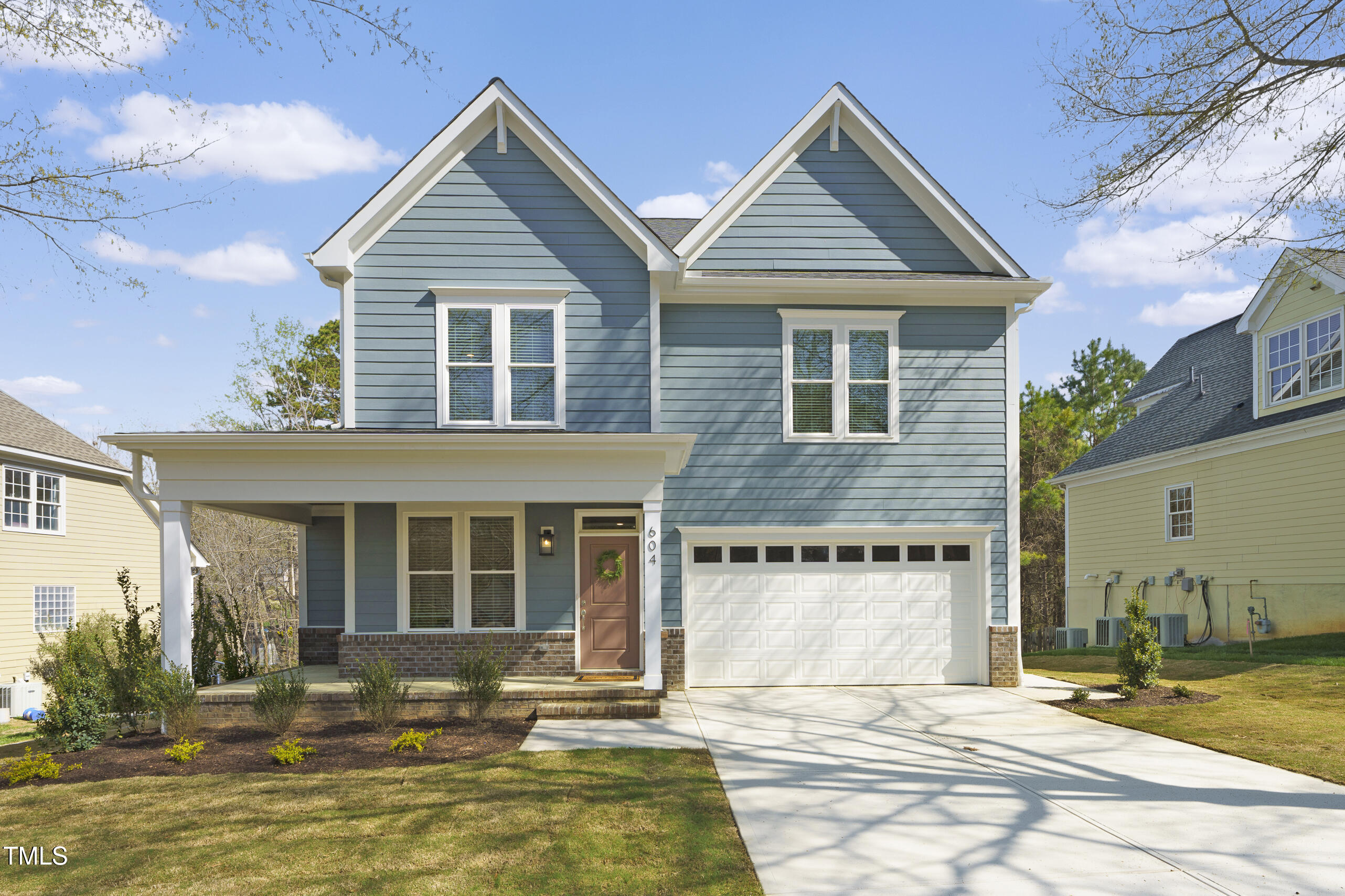 604 Whistable Avenue Wake Forest, NC 27587 - Photo 2 of 44 a front view of a house with a yard
