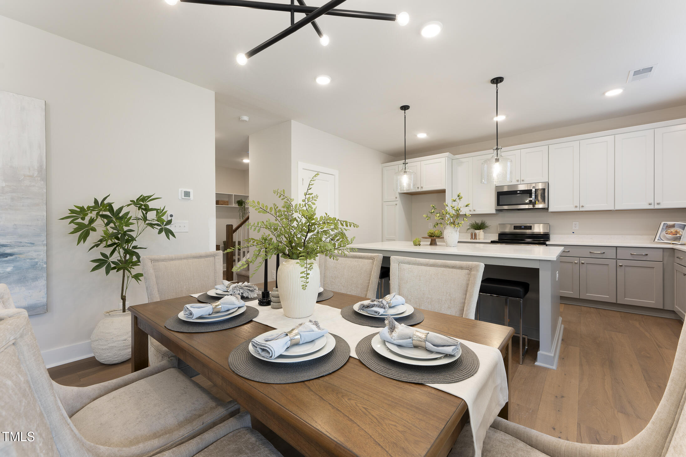604 Whistable Avenue Wake Forest, NC 27587 - Photo 21 of 44 a kitchen with a table and chairs in it