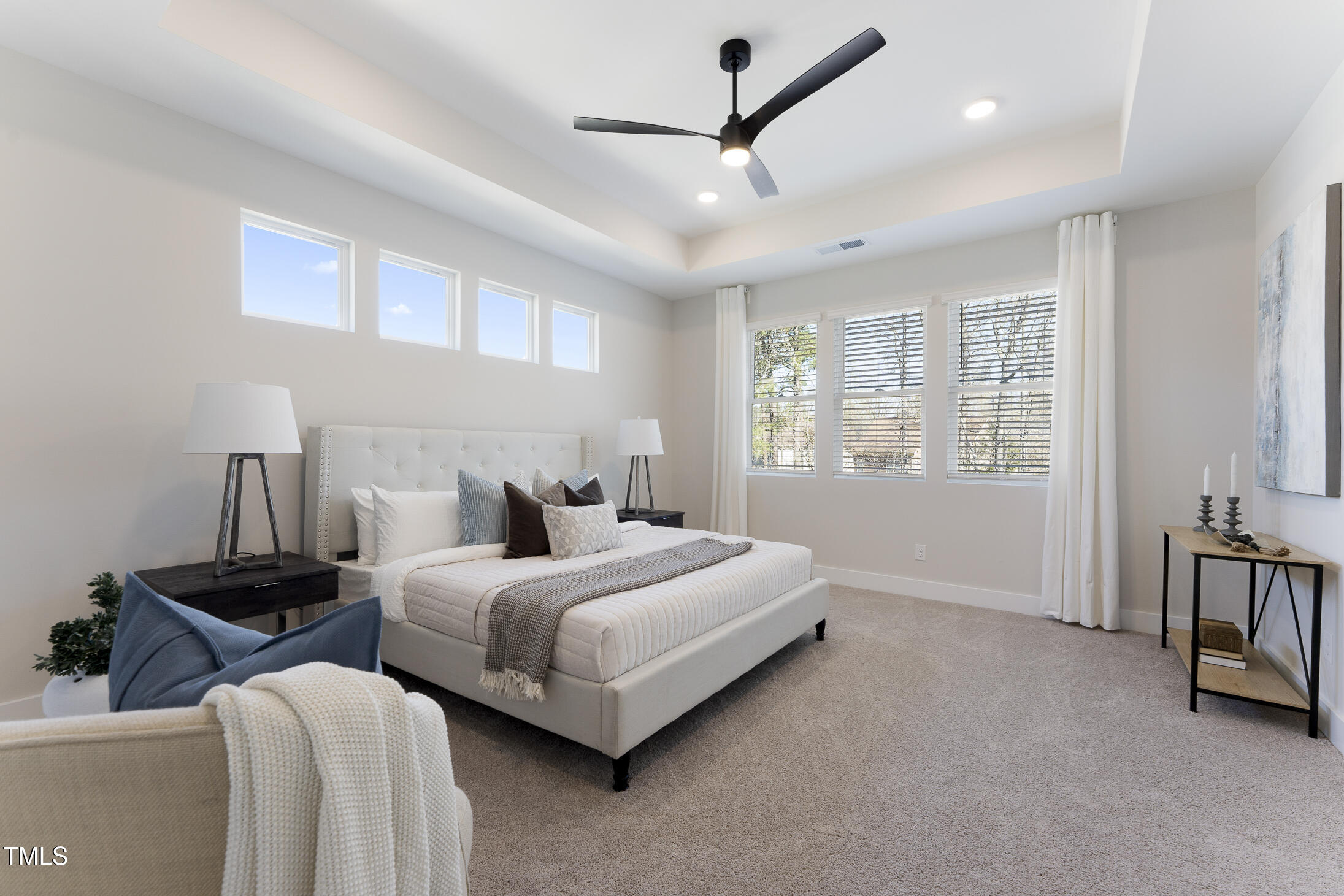 604 Whistable Avenue Wake Forest, NC 27587 - Photo 23 of 44 a bed room with two bed and a ceiling fan