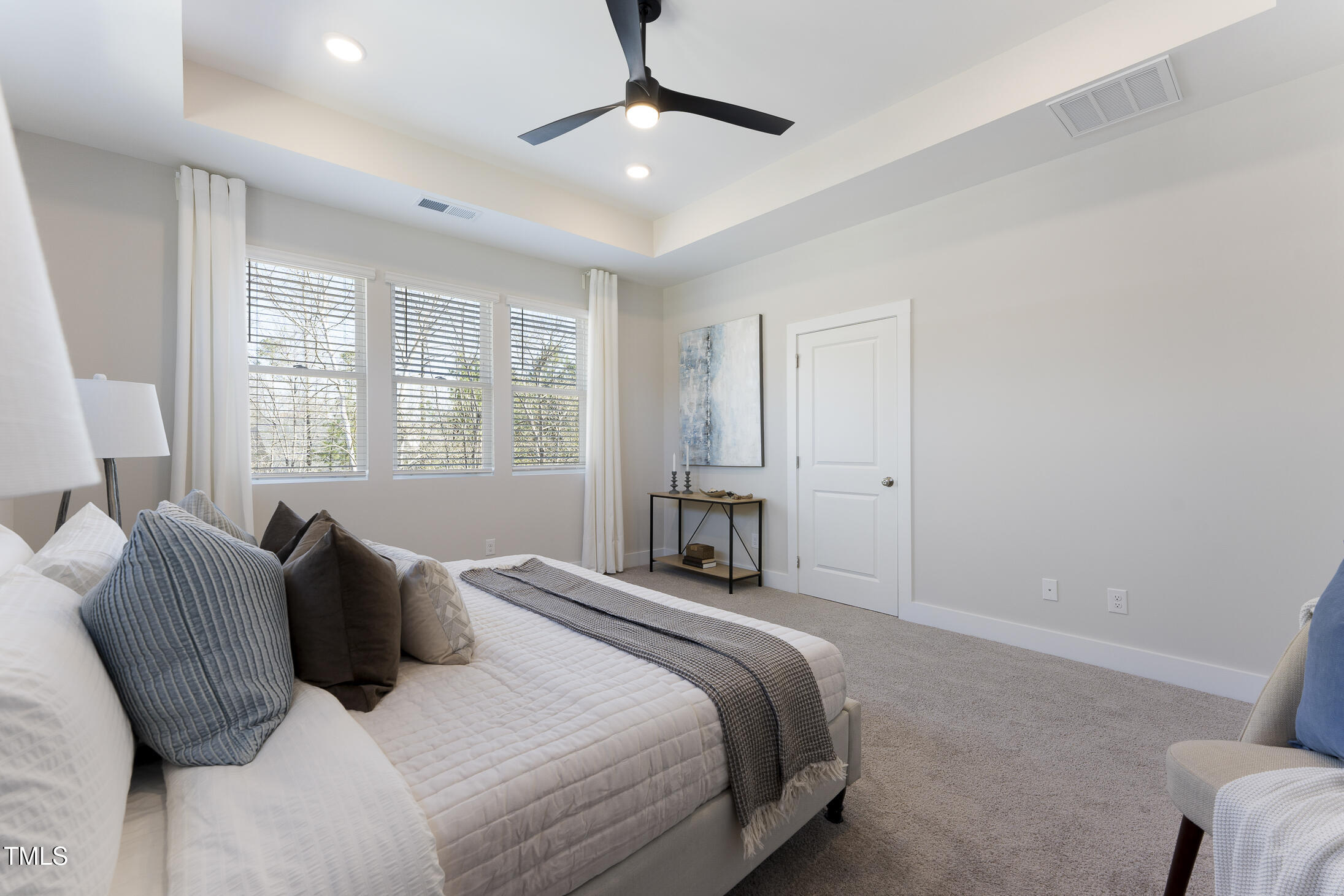 604 Whistable Avenue Wake Forest, NC 27587 - Photo 24 of 44 a bedroom with a bed and a window