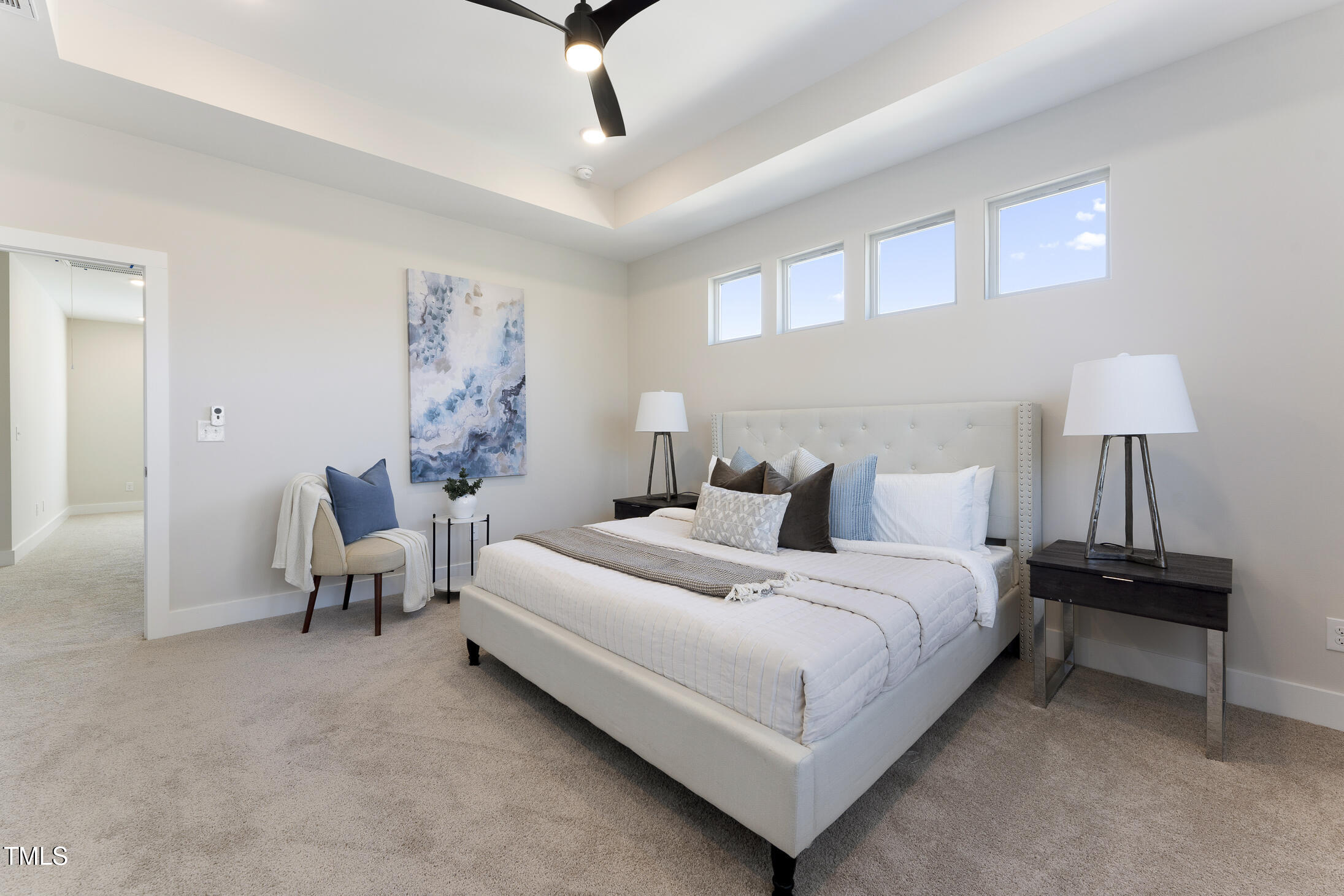 604 Whistable Avenue Wake Forest, NC 27587 - Photo 25 of 44 a bedroom with a bed and a lamp