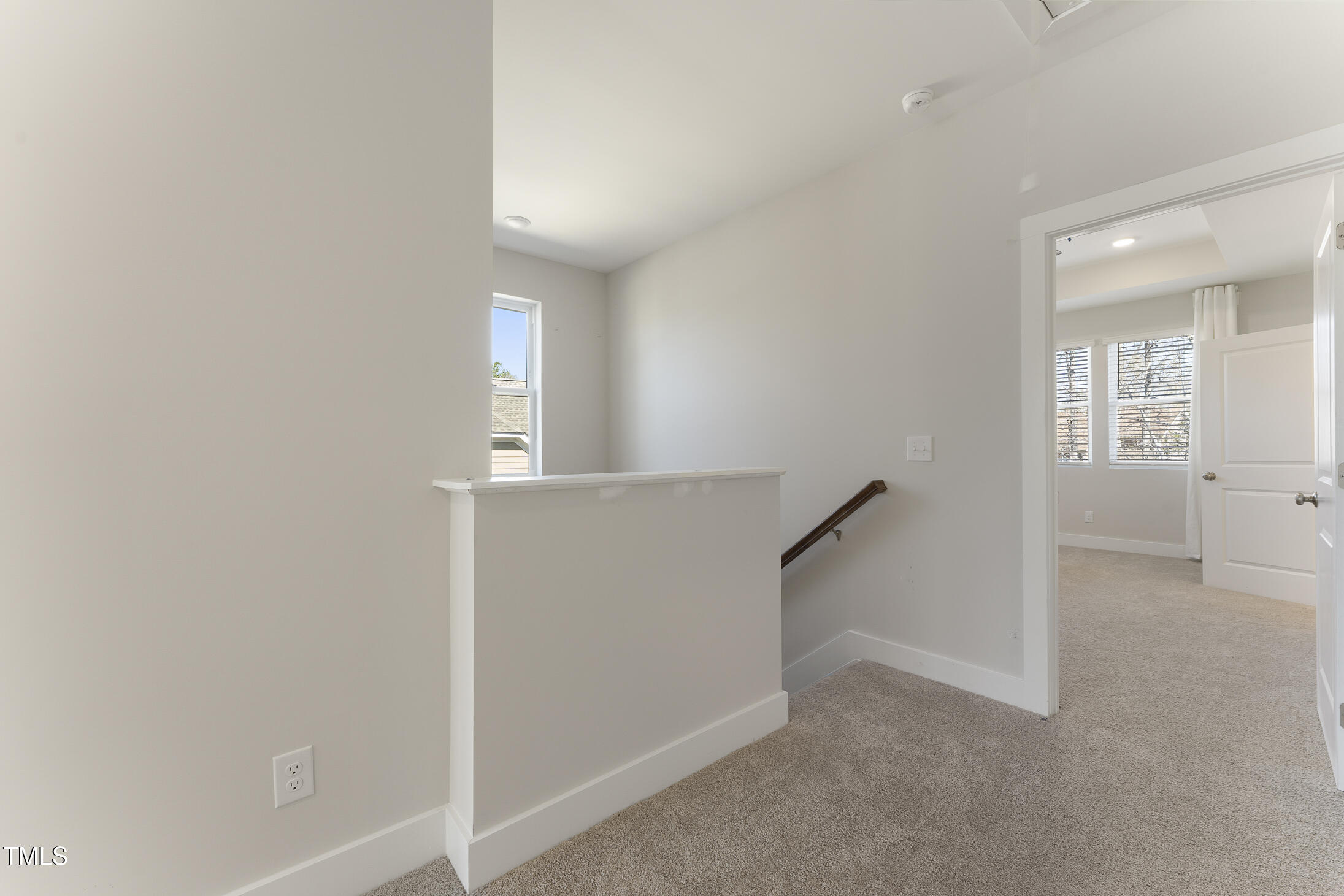 604 Whistable Avenue Wake Forest, NC 27587 - Photo 32 of 44 a view of an empty room with stairs and a window