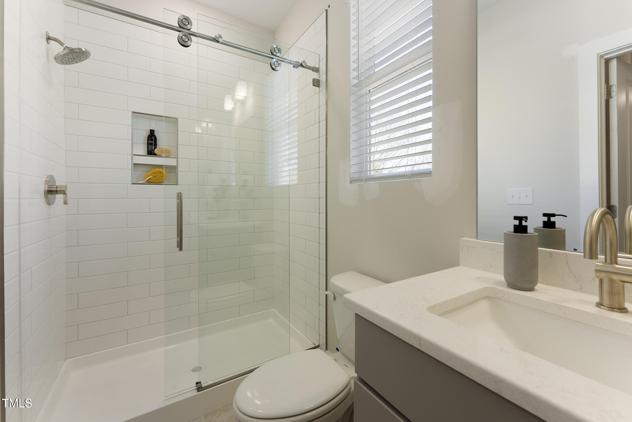 604 Whistable Avenue Wake Forest, NC 27587 - Photo 9 of 44 a bathroom with a sink toilet and shower