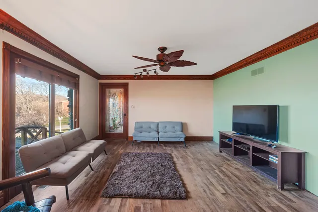 a view of a grassy field with trees