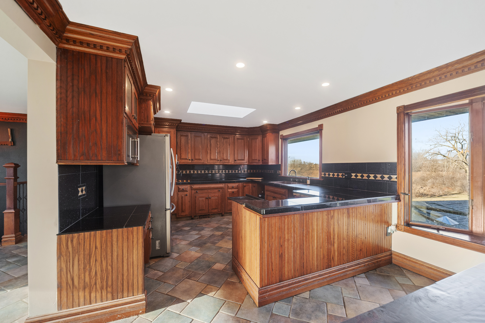 28766 West Burnett Road McHenry, IL 60051 - Photo 4 of 19 a kitchen with stainless steel appliances kitchen island granite countertop a refrigerator and a stove