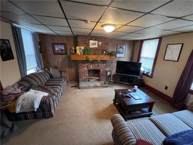 a bedroom with furniture and a fireplace
