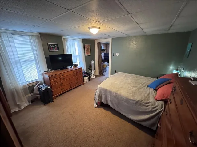 a bedroom with a bed and furniture