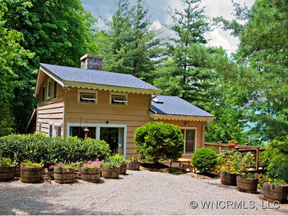 1348 Saunook Road Waynesville, NC 28786 - Photo 1 of 24 a front view of a house with a yard