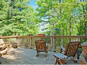 1348 Saunook Road Waynesville, NC 28786 - Photo 14 of 24 a view of a chair and table in the balcony