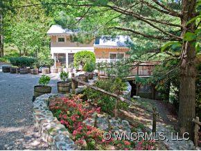 1348 Saunook Road Waynesville, NC 28786 - Photo 15 of 24 a view of a house with a garden and pathway