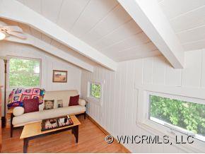 1348 Saunook Road Waynesville, NC 28786 - Photo 6 of 24 a living room with furniture and a large window