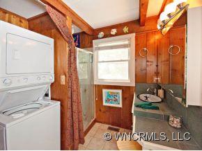 1348 Saunook Road Waynesville, NC 28786 - Photo 8 of 24 a bathroom with a sink and a mirror