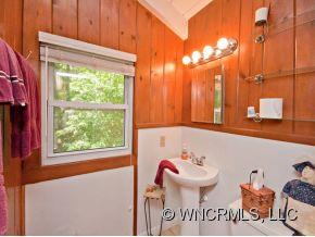 1348 Saunook Road Waynesville, NC 28786 - Photo 10 of 24 a bathroom with a sink and a mirror
