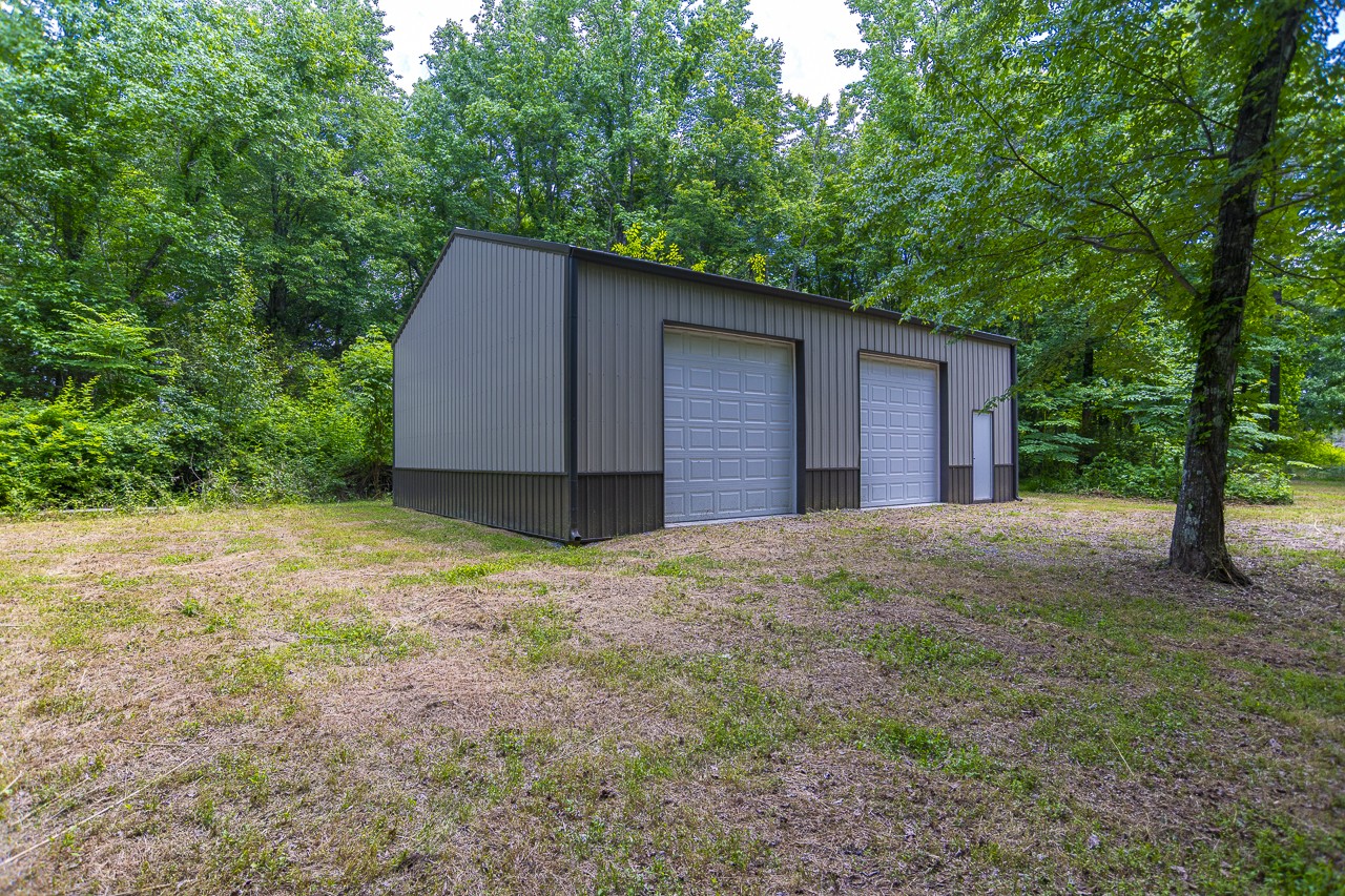 23 Grassy Branch Road Flintville, TN 37335 - Photo 2 of 24 a house with a tree in front of it