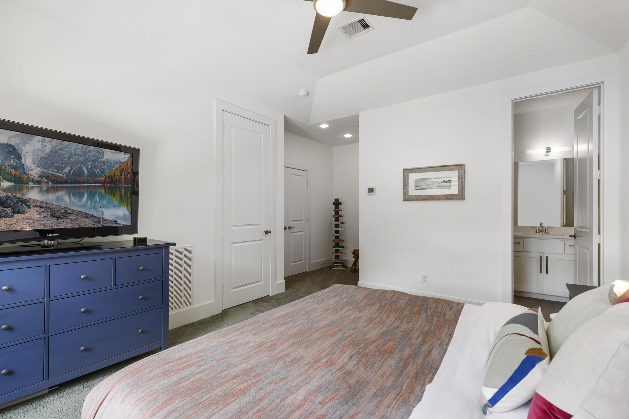 3918 Almond Court Spring, TX 77386 - Photo 28 of 42 a bedroom with a bed and a flat screen tv