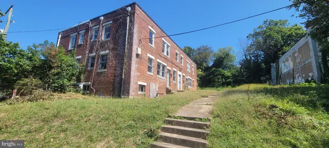 a view of a building with a yard
