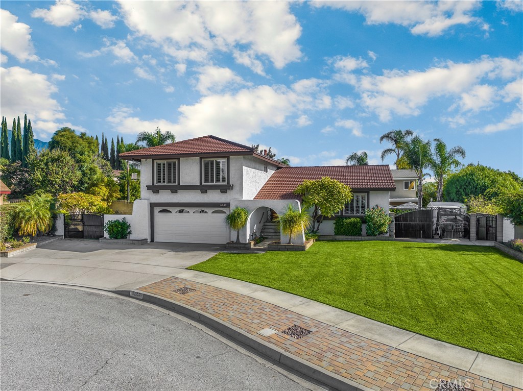 6243 Citrine Street Rancho Cucamonga, CA 91701 - Photo 1 of 1 a front view of house with yard and green space