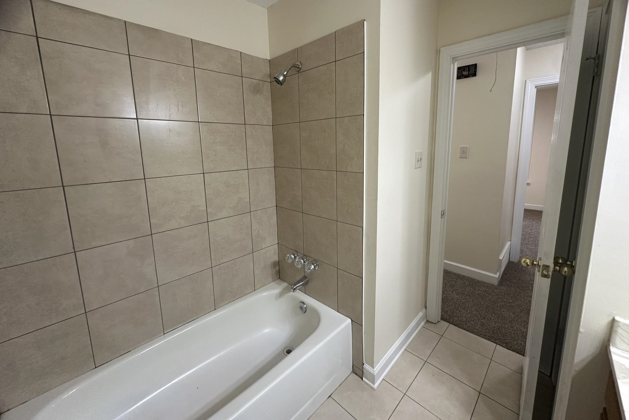 5435 Pine Oak Lane Bartlett, TN 38135 - Photo 11 of 17 a bathroom with a bathtub and shower
