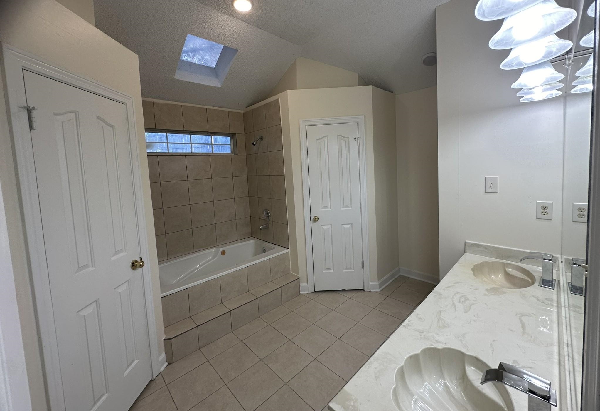 5435 Pine Oak Lane Bartlett, TN 38135 - Photo 12 of 17 a bathroom with a bathtub and shower