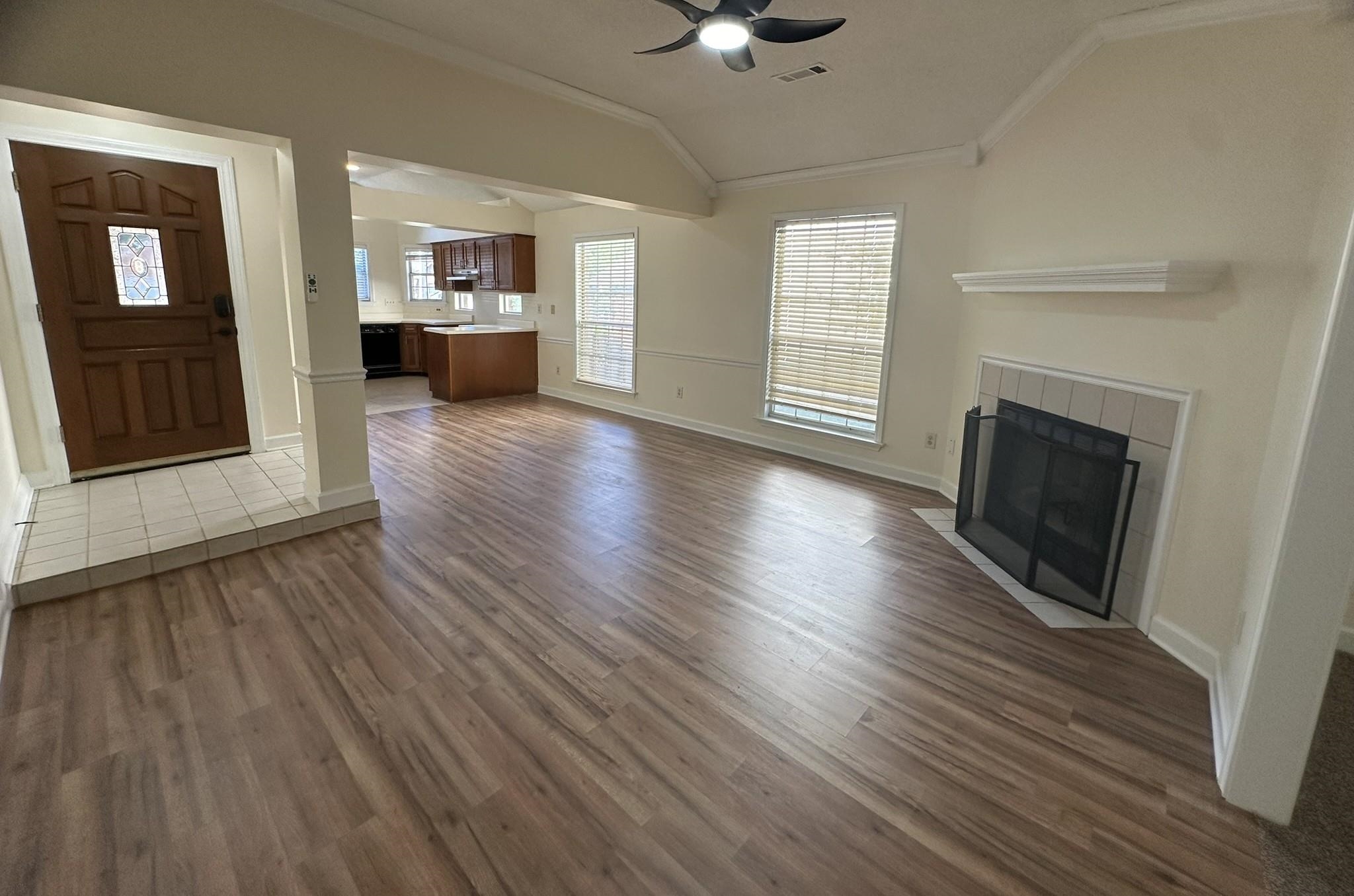 5435 Pine Oak Lane Bartlett, TN 38135 - Photo 3 of 17 a view of a living room a wooden floor and a fireplace