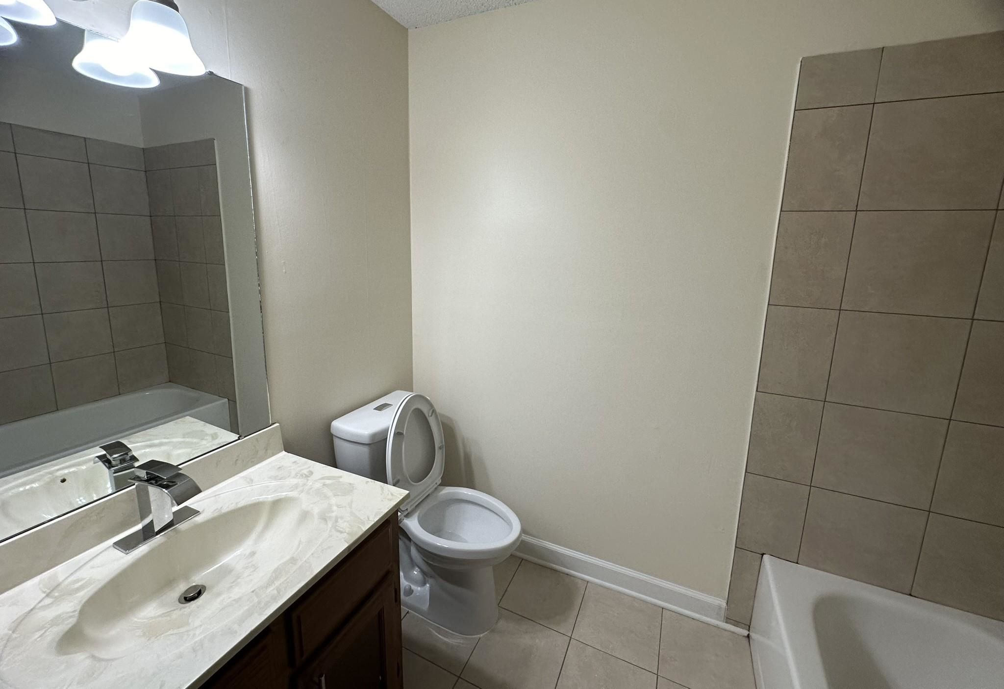 5435 Pine Oak Lane Bartlett, TN 38135 - Photo 10 of 17 a bathroom with a sink vanity and toilet