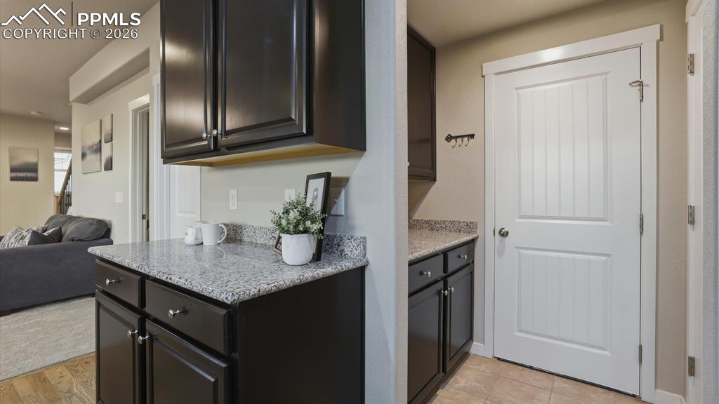 7872 Callendale Drive Colorado Springs, CO 80908 - Photo 19 of 50 Mud Room with upper and lower cabinets and convenient garage access.