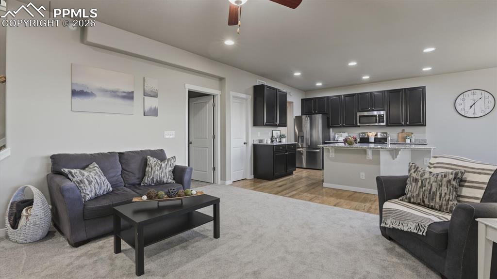 7872 Callendale Drive Colorado Springs, CO 80908 - Photo 20 of 50 The Living Room opens to the Kitchen, great for entertaining family and friends.