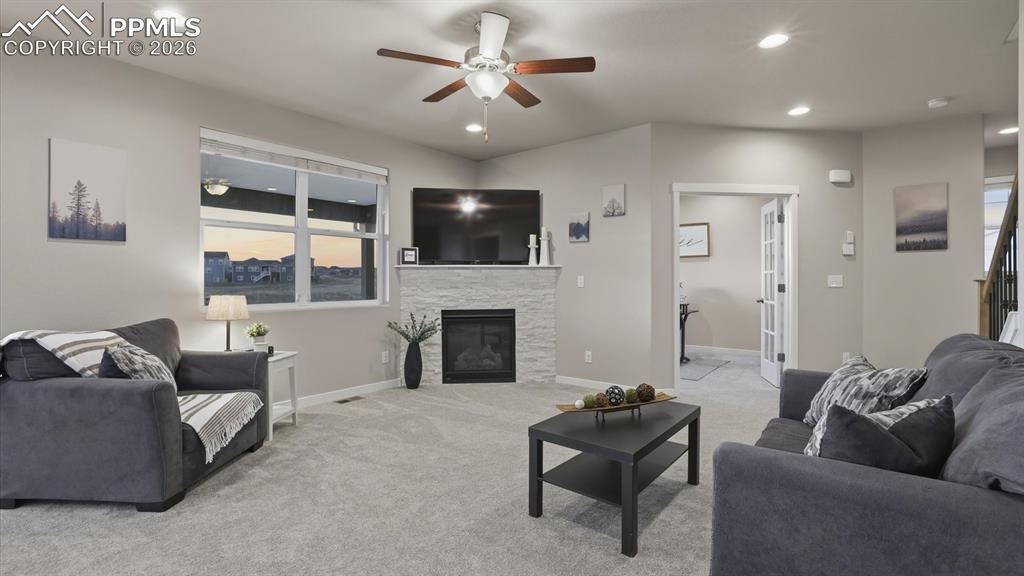 7872 Callendale Drive Colorado Springs, CO 80908 - Photo 21 of 50 The Living Room offers a gas fireplace to cozy up on chilly evenings.