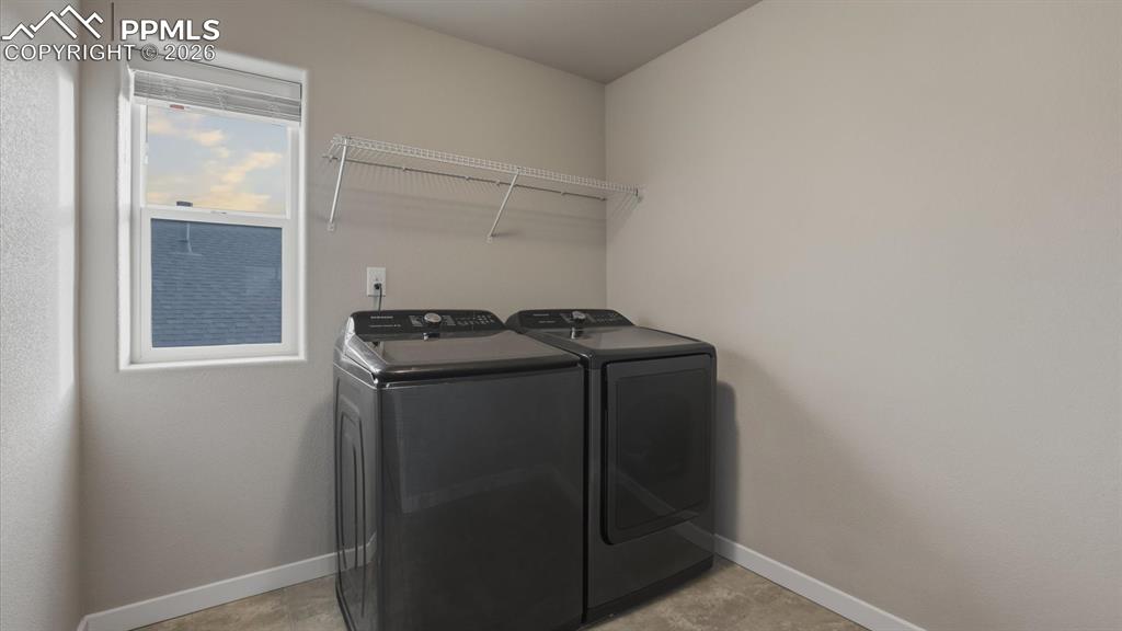 7872 Callendale Drive Colorado Springs, CO 80908 - Photo 29 of 50 Upper Level Laundry Room with with washer and dryer that stays.