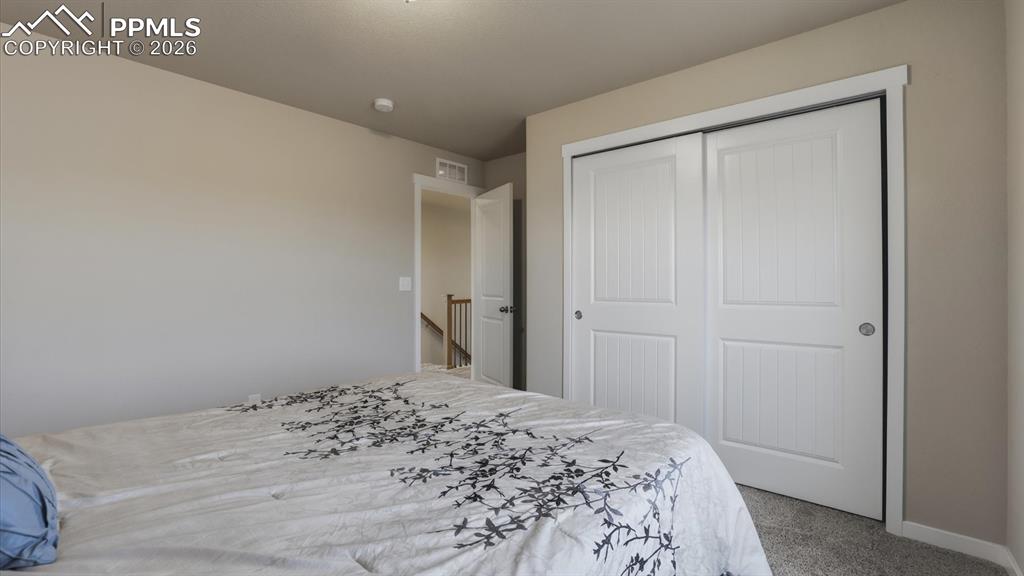 7872 Callendale Drive Colorado Springs, CO 80908 - Photo 31 of 50 Upper Level Bedroom #2 has a generous closet.