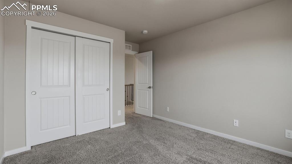 7872 Callendale Drive Colorado Springs, CO 80908 - Photo 33 of 50 Upper Level Bedroom #3 has a generous closet.