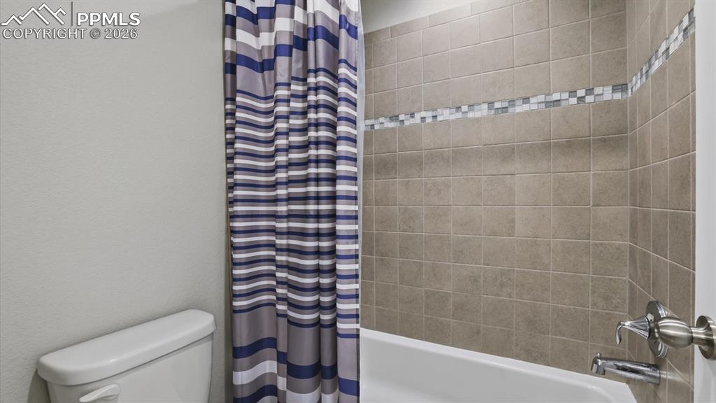 7872 Callendale Drive Colorado Springs, CO 80908 - Photo 35 of 50 Tiled tub/shower in upper level Full Hall Bathroom.