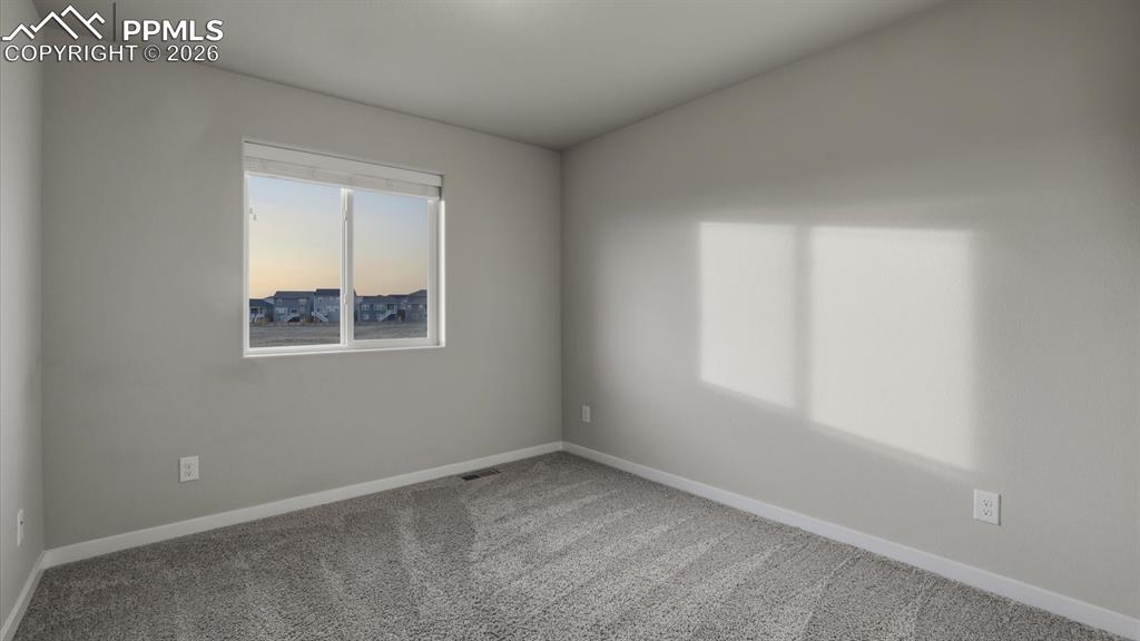 7872 Callendale Drive Colorado Springs, CO 80908 - Photo 36 of 50 Upper Level Bedroom #4 with neutral carpet.