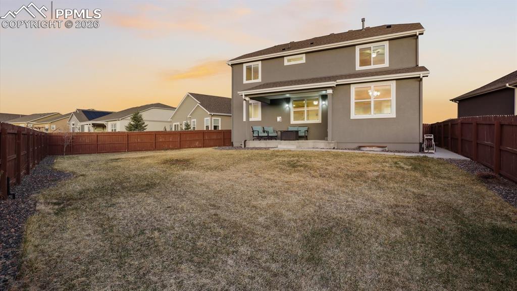 7872 Callendale Drive Colorado Springs, CO 80908 - Photo 49 of 50 Rear view of home and fenced yard.