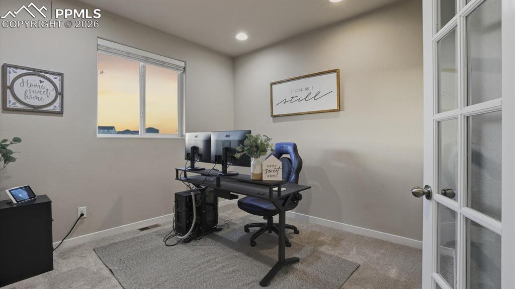 7872 Callendale Drive Colorado Springs, CO 80908 - Photo 10 of 50 French doors lead into a dedicated home office.