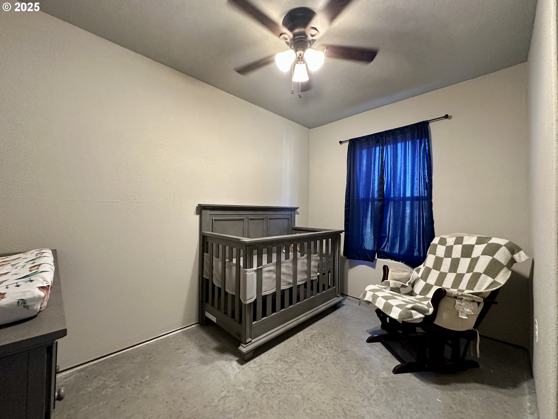 416 4th Street Summerville, OR 97876 - Photo 12 of 40 a bedroom with furniture and a chandelier