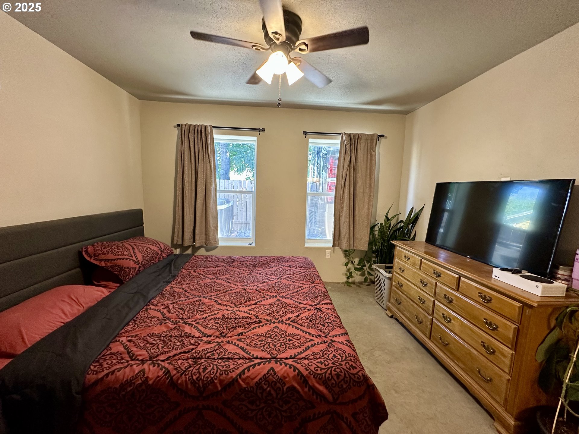 416 4th Street Summerville, OR 97876 - Photo 18 of 40 a bedroom with bed and flat screen tv